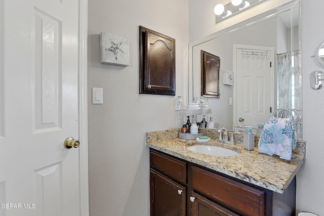 bathroom with vanity and walk in shower