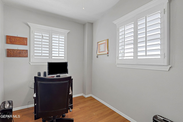 office area with hardwood / wood-style floors