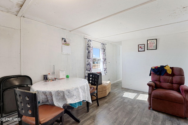 dining space with hardwood / wood-style flooring