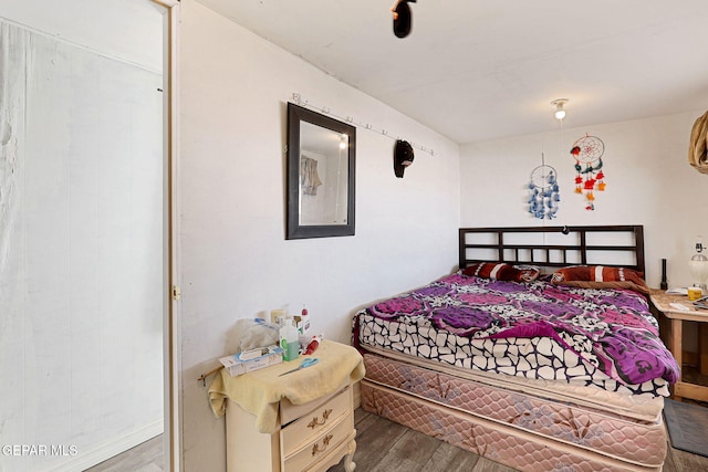 bedroom with hardwood / wood-style floors