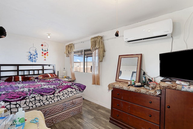 bedroom featuring dark wood-type flooring and a wall mounted air conditioner