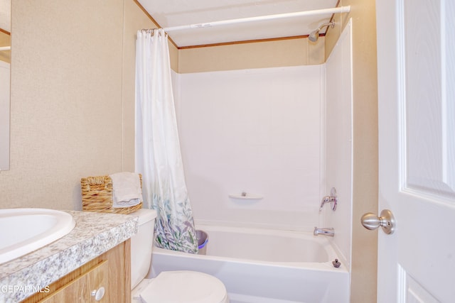 full bathroom with vanity, shower / bath combo, and toilet