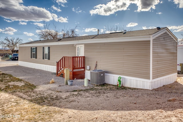 view of side of property featuring central air condition unit