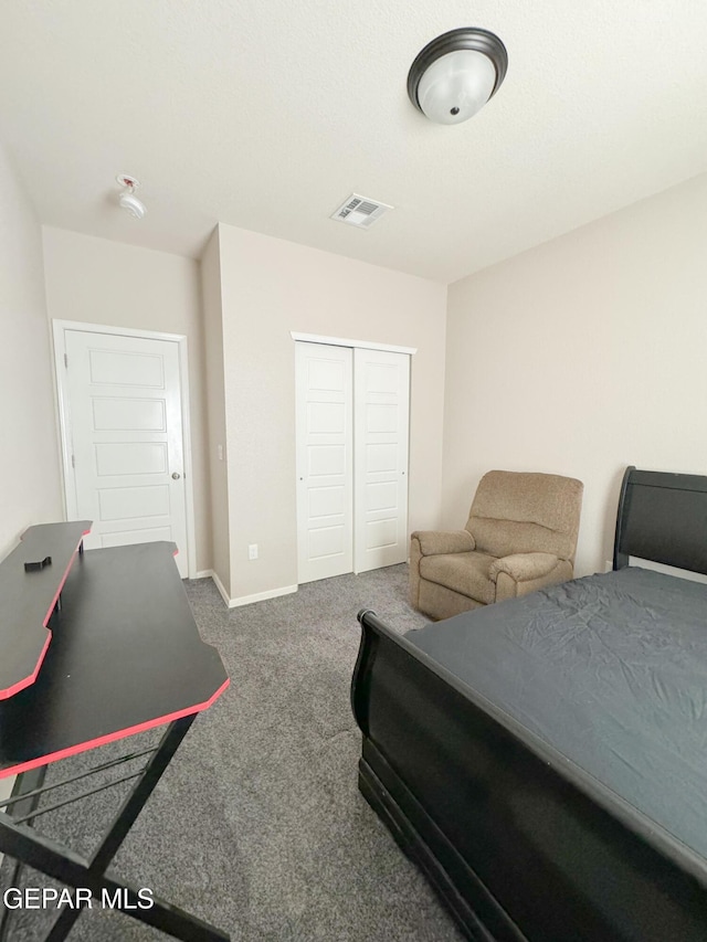 carpeted bedroom featuring a closet