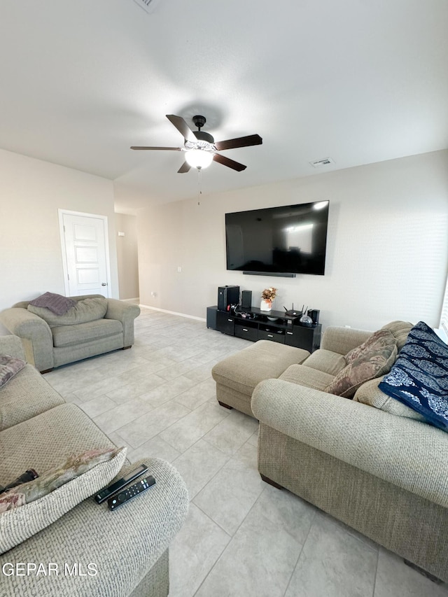 living room with light tile patterned flooring and ceiling fan