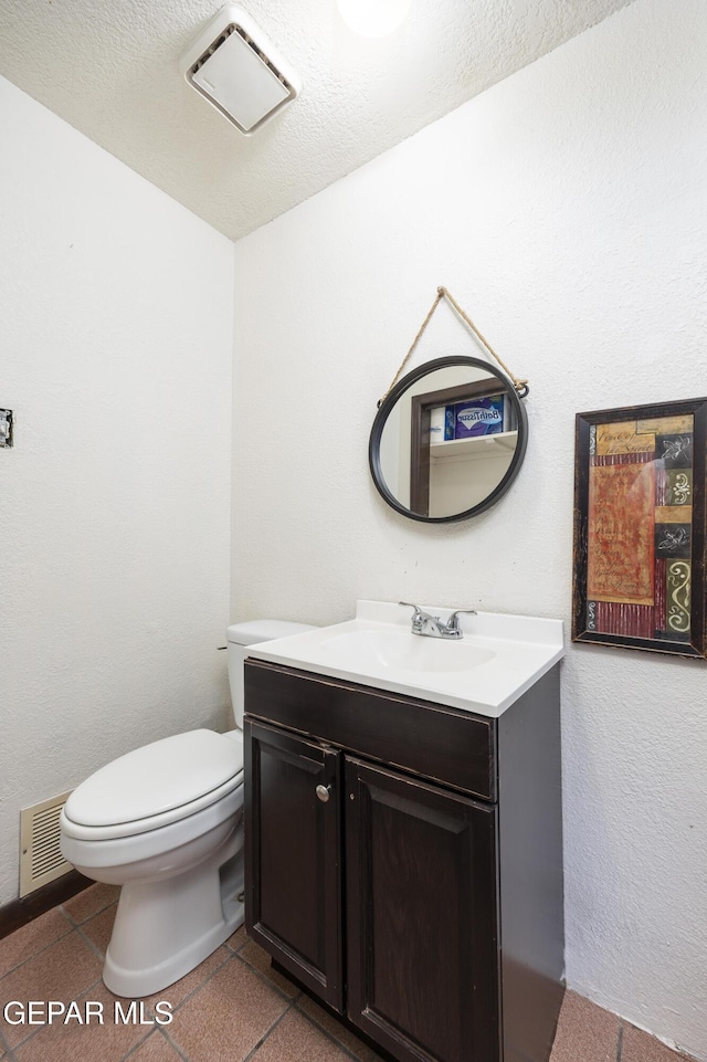 5047 Conley Rd, El Paso, TX 79932 - bathroom with vanity, tile patterned floors, and toilet