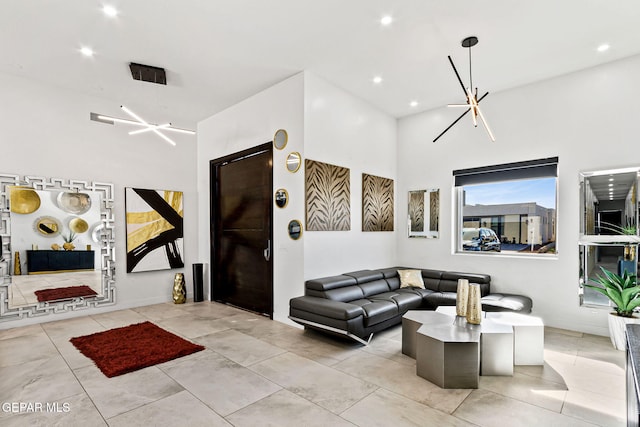 tiled living room featuring a chandelier