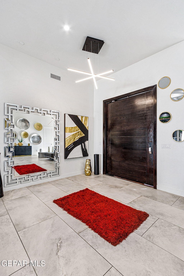 entrance foyer featuring tile patterned flooring