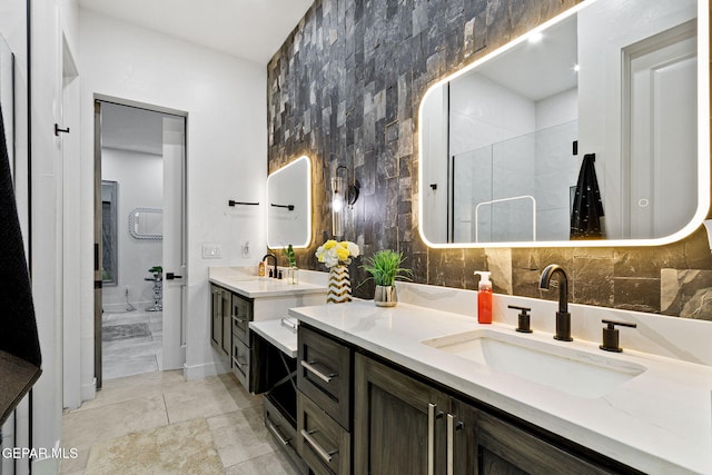 bathroom featuring vanity, backsplash, tile patterned flooring, and tile walls