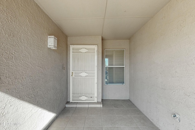 property entrance featuring stucco siding