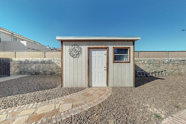 view of shed featuring a fenced backyard