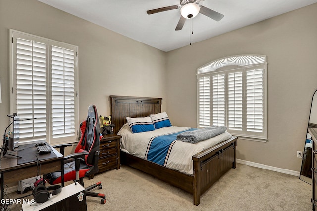 bedroom with carpet, baseboards, and ceiling fan