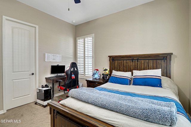 bedroom with light colored carpet and ceiling fan