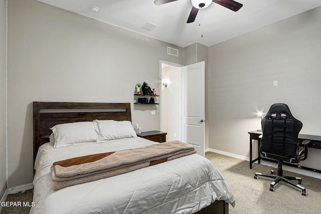 carpeted bedroom featuring visible vents, baseboards, and ceiling fan