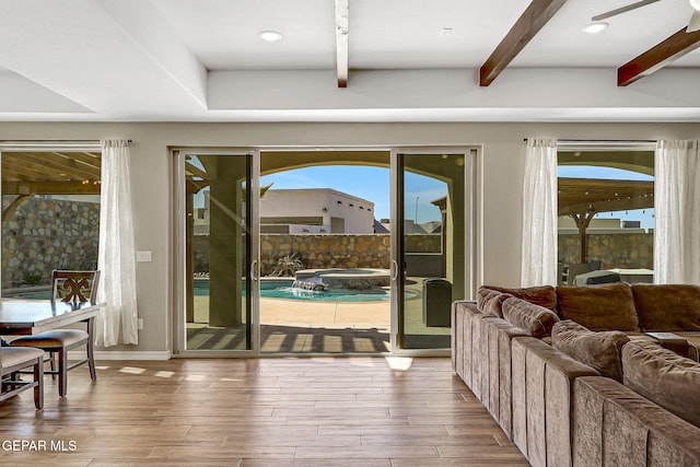 entryway featuring recessed lighting, baseboards, beam ceiling, and wood finished floors