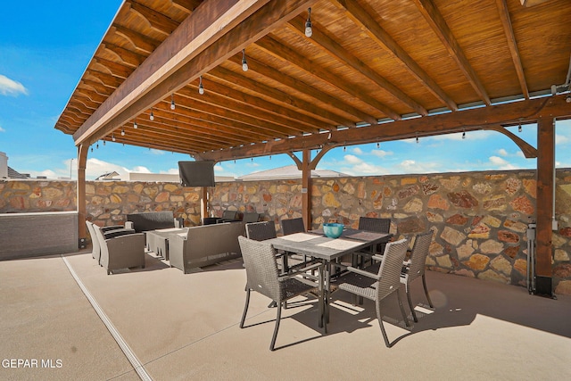 view of patio with outdoor dining area and an outdoor hangout area