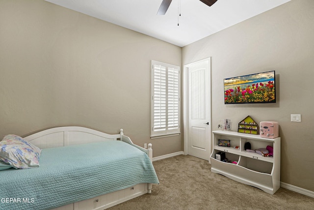 carpeted bedroom featuring a ceiling fan and baseboards