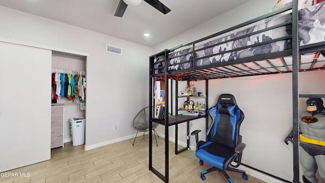 bedroom featuring ceiling fan and light hardwood / wood-style floors