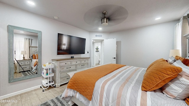 bedroom with ceiling fan and light hardwood / wood-style floors