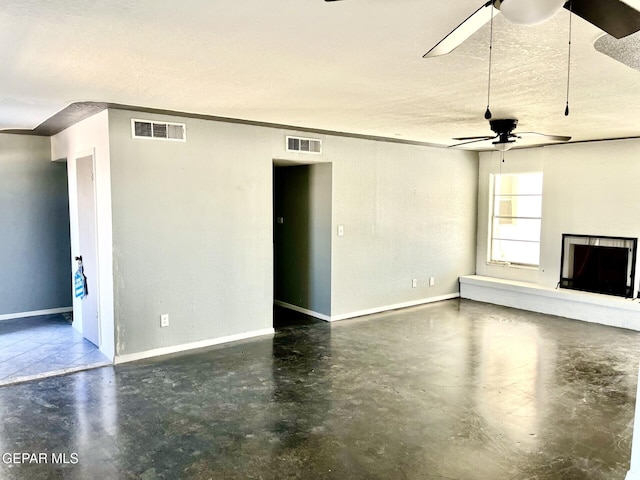 unfurnished living room featuring a textured ceiling and ceiling fan