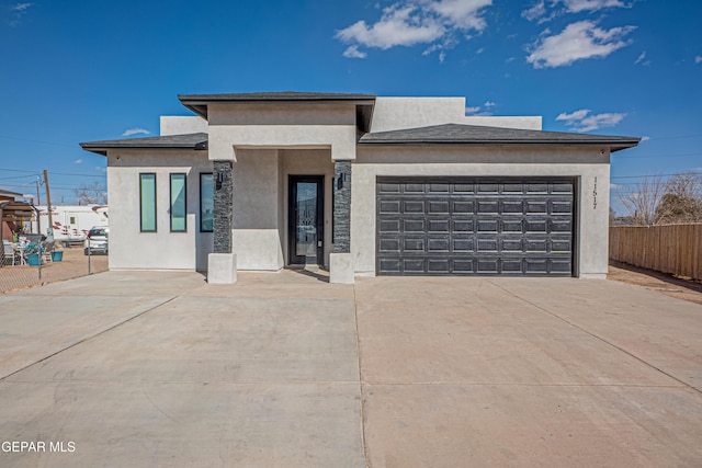 prairie-style house featuring a garage