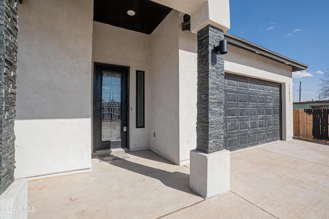 view of exterior entry featuring a garage