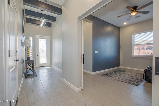 entrance foyer with a healthy amount of sunlight and ceiling fan