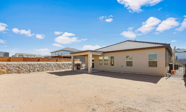 rear view of property featuring a patio