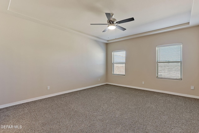 empty room featuring ceiling fan and carpet flooring