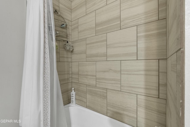 bathroom with shower / bath combination with curtain