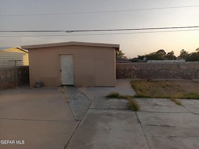 view of outdoor structure at dusk