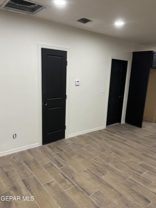 unfurnished room featuring wood-type flooring