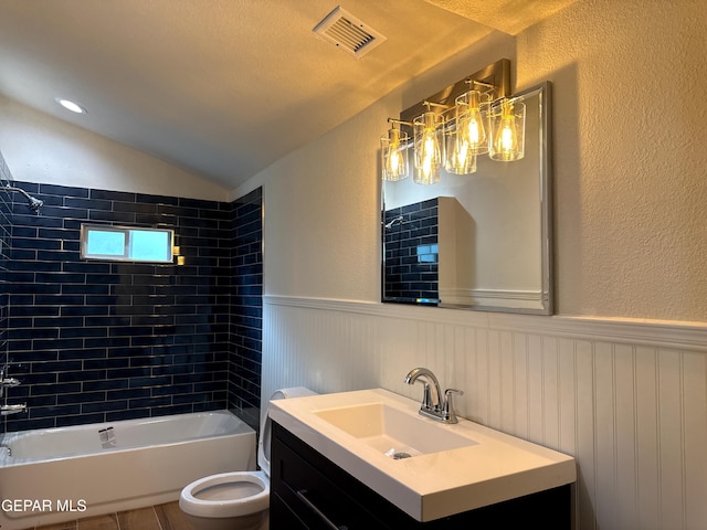 full bath featuring a wainscoted wall, visible vents, shower / bathtub combination, and vaulted ceiling