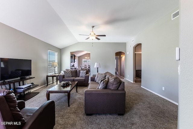 living room with vaulted ceiling, carpet flooring, and ceiling fan with notable chandelier