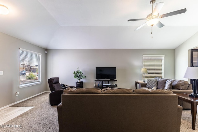 carpeted living room featuring lofted ceiling and ceiling fan