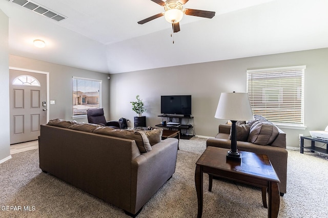 living room featuring lofted ceiling, light carpet, and ceiling fan