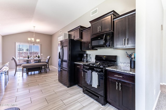 kitchen featuring lofted ceiling, hanging light fixtures, dark brown cabinets, light stone countertops, and black appliances