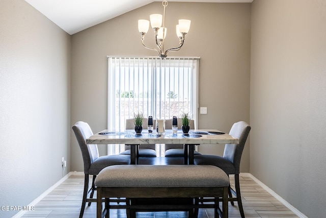 dining room with vaulted ceiling and a chandelier