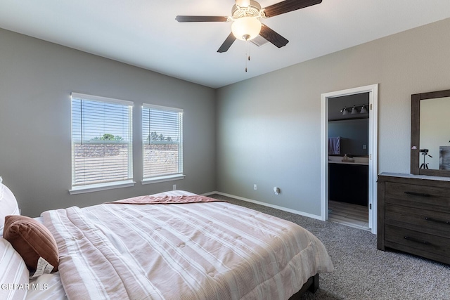 carpeted bedroom with connected bathroom and ceiling fan