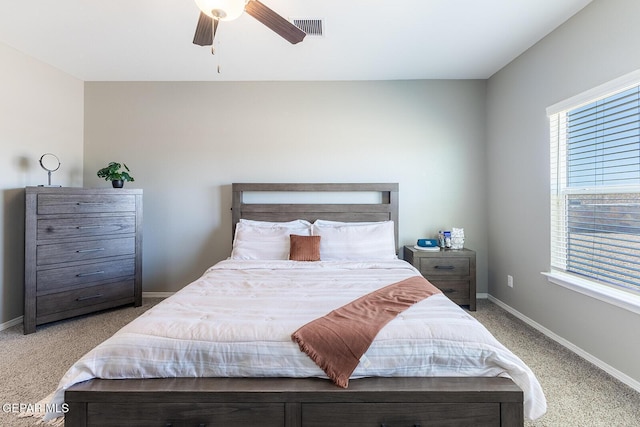 bedroom featuring ceiling fan and light carpet