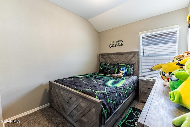 bedroom with lofted ceiling and carpet floors