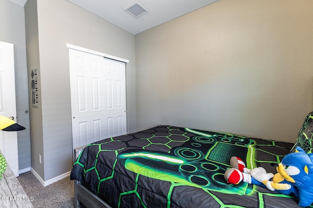 carpeted bedroom with a closet