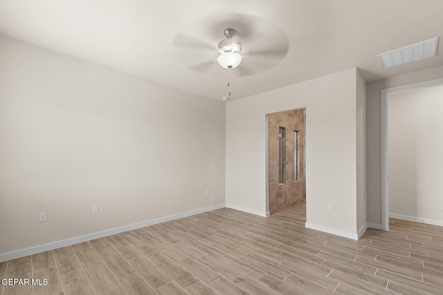 spare room with ceiling fan