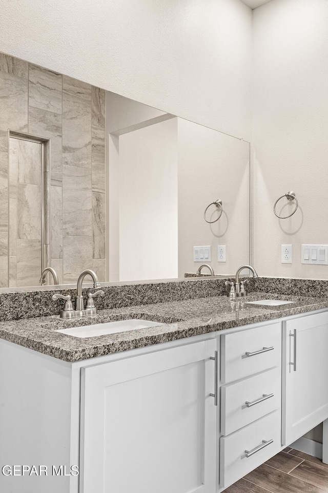 bathroom featuring hardwood / wood-style flooring and vanity