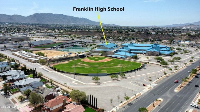 birds eye view of property featuring a mountain view