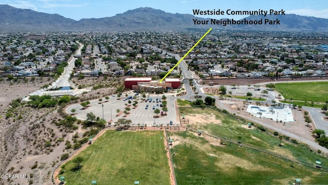 birds eye view of property with a mountain view