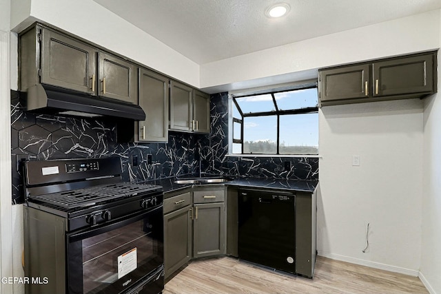 kitchen with sink, backsplash, black appliances, and light wood-type flooring