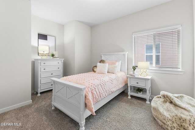 bedroom with dark colored carpet