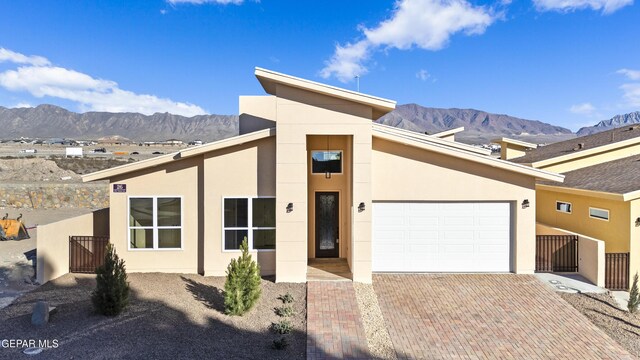 view of front of house featuring a mountain view and a garage