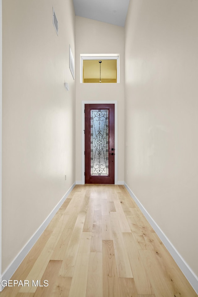 doorway with light hardwood / wood-style flooring